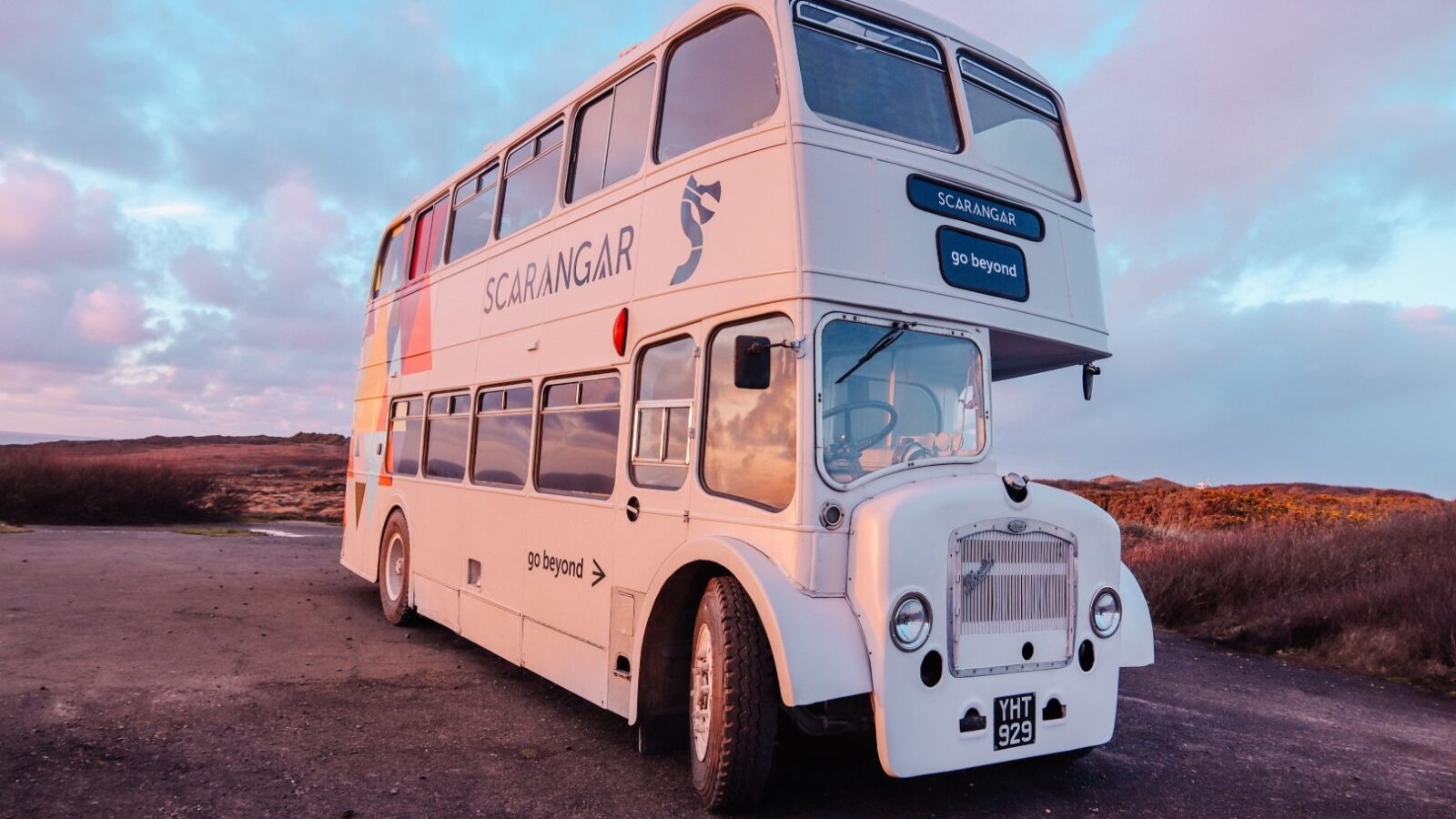 A white double-decker bus with 