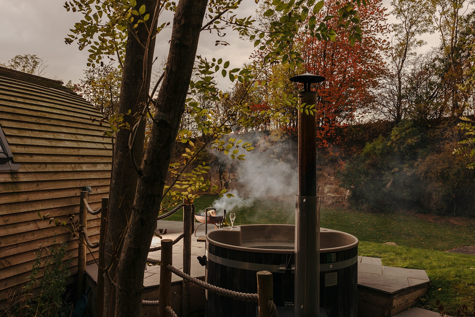 The hot tub and fire pit at Forcett Grange adults-only cabins in Yorkshire