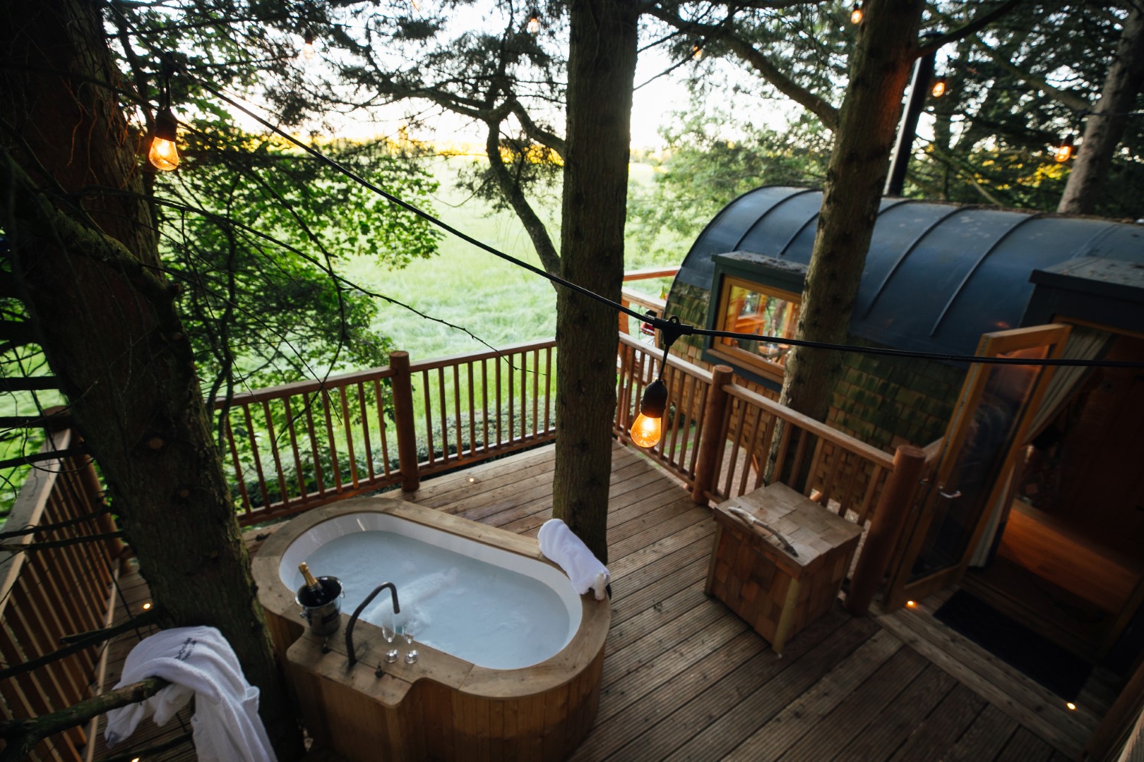 Orchard at Fenny Castle treehouses Somerset | Best UK treehouses | Treehouses with bath on decking hot tub